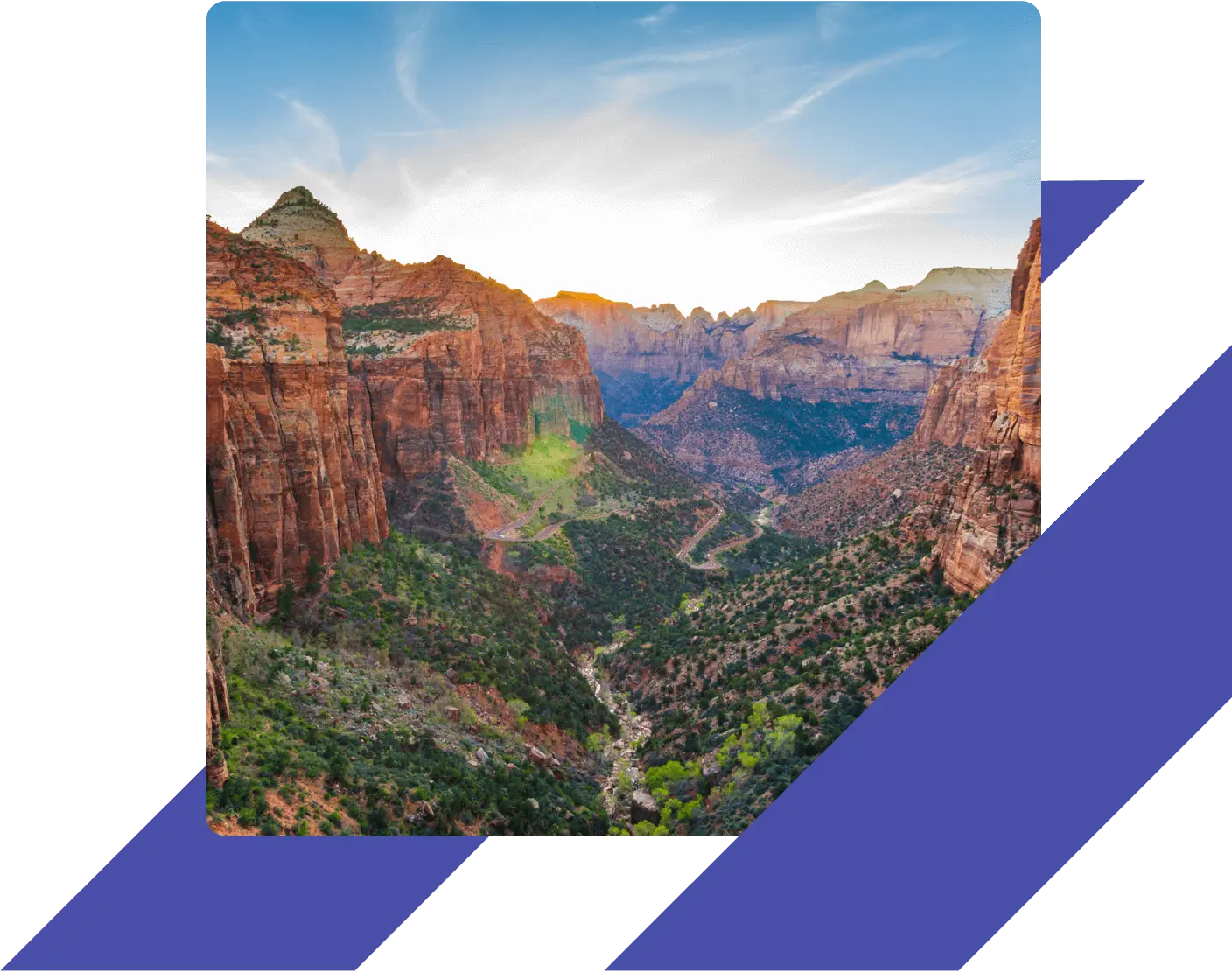 A scenic view of Zion National Park at sunset, with red rock cliffs and a winding canyon road below.