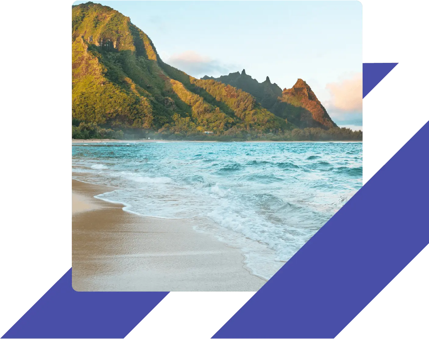 Scenic view of a sandy beach in Hawaii with turquoise ocean waves and lush green mountains in the background.