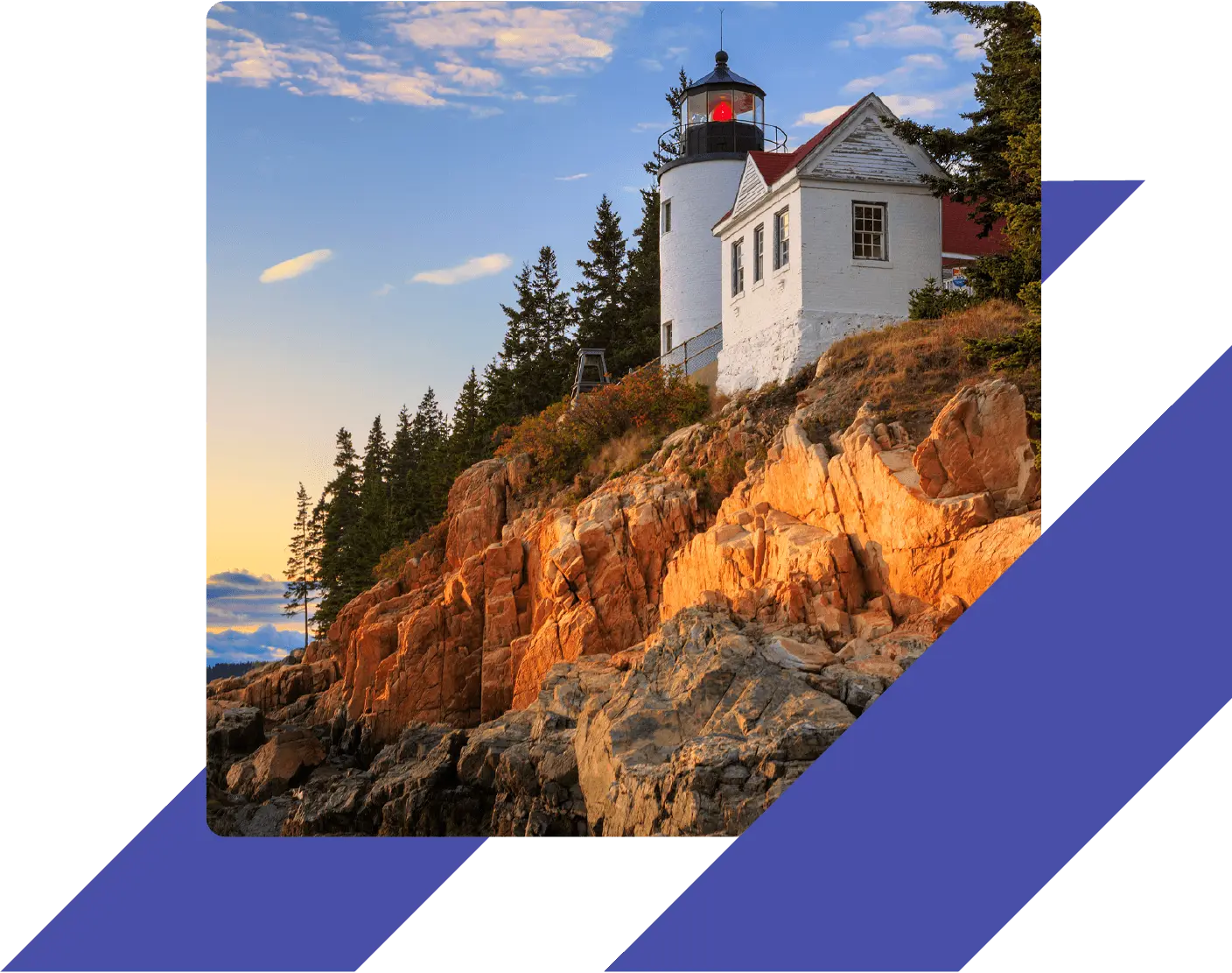 Bass Harbor Head Lighthouse in Maine at sunset, sitting atop rugged coastal cliffs surrounded by pine trees.