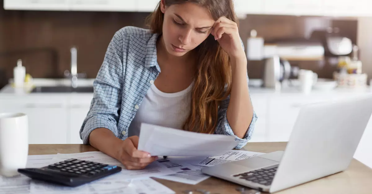 An image of a woman reading a document.