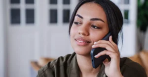 An image of a woman talking on a phone.