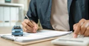 A closeup picture of a person writing a letter.
