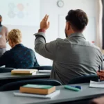 A picture of a classroom with people.