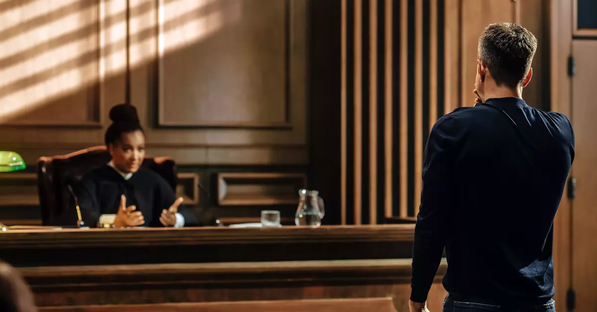 Judge talking to a man.